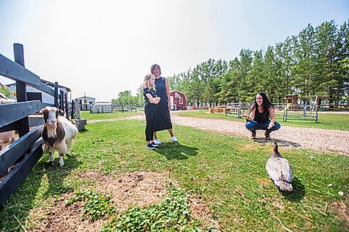 MIKAELA MACKENZIE / WINNIPEG FREE PRESS

Macyn Comeault (left), Carissa Comeault, and Lucy Sloan take a walk around the farm at Lil' Steps Wellness Farm in St. Malo on Friday, Aug. 6, 2021. For Sabrina story.
Winnipeg Free Press 2021.