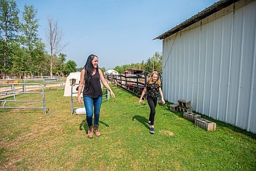 MIKAELA MACKENZIE / WINNIPEG FREE PRESS

Lucy Sloan (left) and Macyn Comeault take a look at the miniature horses at Lil' Steps Wellness Farm in St. Malo on Friday, Aug. 6, 2021. For Sabrina story.
Winnipeg Free Press 2021.