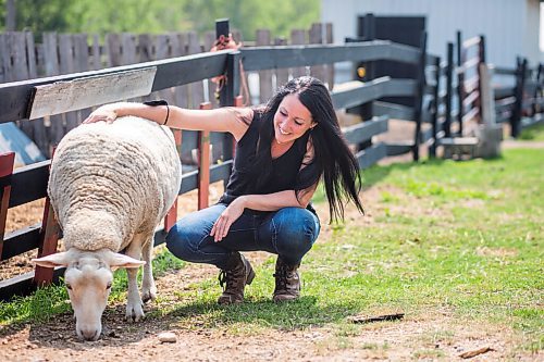 MIKAELA MACKENZIE / WINNIPEG FREE PRESS

Lucy Sloan, registered counsellor and owner of Lil' Steps Wellness Farm, poses for a portrait with Apple the sheep at the farm in St. Malo on Friday, Aug. 6, 2021. For Sabrina story.
Winnipeg Free Press 2021.
