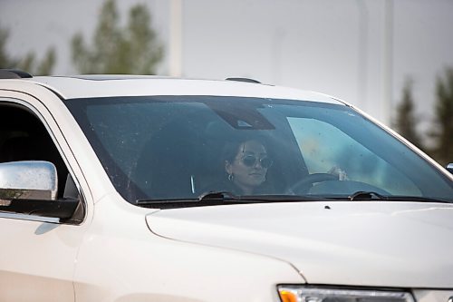 MIKAELA MACKENZIE / WINNIPEG FREE PRESS

Taylor Friesen drives into Canada on the first day the border re-opened to fully vaccinated folks from the United States at Emerson on Monday, Aug. 9, 2021. For Gabby story.
Winnipeg Free Press 2021.