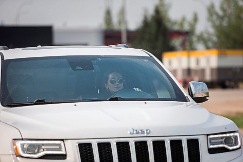 MIKAELA MACKENZIE / WINNIPEG FREE PRESS

Taylor Friesen drives into Canada on the first day the border re-opened to fully vaccinated folks from the United States at Emerson on Monday, Aug. 9, 2021. For Gabby story.
Winnipeg Free Press 2021.