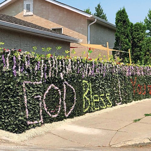 Canstar Community News Cherrie Augustins fence spells out a message to all of us.
