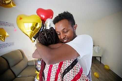 JOHN WOODS / WINNIPEG FREE PRESS
Tewedaje Asele and her husband Lidetu are happy to see each other in their new apartment in Winnipeg Monday, August 9, 2021. The couple hasnt seen each other for seventeen months because of COVID-19 restrictions and Tewedaje lived in the United States. She drove from Minnesota this morning to join her husband in Winnipeg after Canada opened its border to the US.


