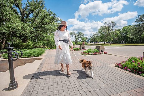 MIKAELA MACKENZIE / WINNIPEG FREE PRESS

Jamie Barber, owner and head trainer of Candor Canine, poses for a portrait with her dog, Indy, at Assiniboine Park in Winnipeg on Tuesday, Aug. 10, 2021. Candor Canine recently started offering a doggie wedding date service, where Jamie (or one of her staffers) will take care of a couples' pooch for the event. For Eva Wasney story.
Winnipeg Free Press 2021.