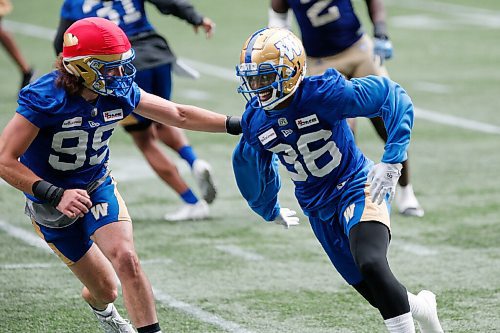 JOHN WOODS / WINNIPEG FREE PRESS
Winnipeg Blue Bombers Jontrell Rocquemore (36) tries to get past Nick Dheilly (99) at practice in Winnipeg Tuesday, August 10, 2021. 
