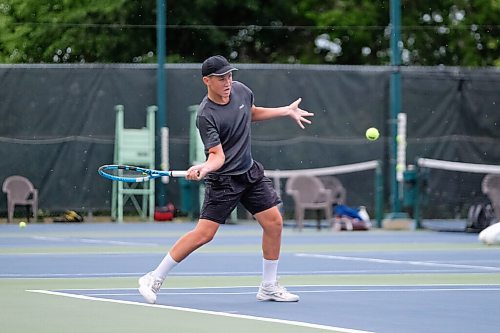 Daniel Crump / Independent. Volodymyr Gurenko returns the ball during the first round of the Manitoba Open at Kildonan Tennis Club. August 10, 2021.