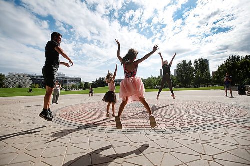 JOHN WOODS / WINNIPEG FREE PRESS
Magdalena McGregor, right, member with RWB Artistic Faculty, instructs, from left, Matthew Plett and his daughters Emley and Aubrey, and other children in a creative movement class at The Forks in Winnipeg Wednesday, August 11, 2021. The RWB will be holding these free classes on Wednesdays throughout August.
