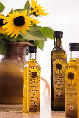 MIKAELA MACKENZIE / WINNIPEG FREE PRESS

Some of the finished bottled sunflower oil at Ploughshares Community Farm near Beausejour on Thursday, Aug. 12, 2021. For Jen story.
Winnipeg Free Press 2021.