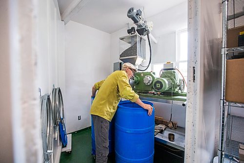 MIKAELA MACKENZIE / WINNIPEG FREE PRESS

David Braun listens to the machine while pressing sunflower seeds into oil at Ploughshares Community Farm near Beausejour on Thursday, Aug. 12, 2021. For Jen story.
Winnipeg Free Press 2021.