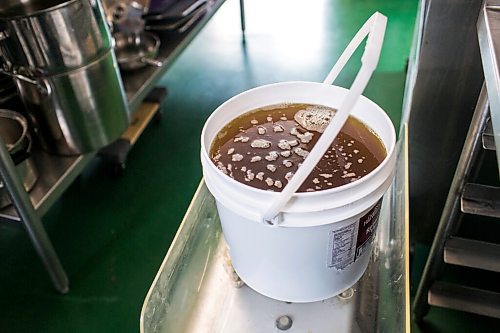 MIKAELA MACKENZIE / WINNIPEG FREE PRESS

A bucket of sunflower oil at Ploughshares Community Farm near Beausejour on Thursday, Aug. 12, 2021. For Jen story.
Winnipeg Free Press 2021.