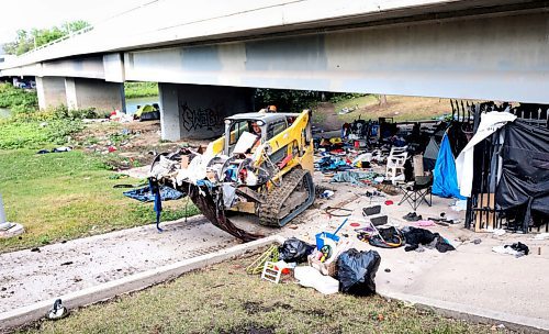 RUTH BONNEVILLE / WINNIPEG FREE PRESS

Local - Homeless encampment 

Main Street Project crews and city of Wpg personal remove large quantities of debris from a large homeless encampment under the Maryland Street bridge on Thursday morning.  

Aug 12th, 2021
