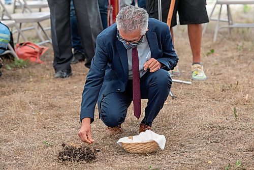 ALEX LUPUL / WINNIPEG FREE PRESS  

Dr. Michael Benarroch, President and Vice-Chancellor at the University of Manitoba, sprinkles tobacco into a hole dug at a land blessing ceremony for the future home of the National Centre for Truth and Reconciliation in Winnipeg on Thursday, August 12, 2021.

Reporter: Cody Sellar