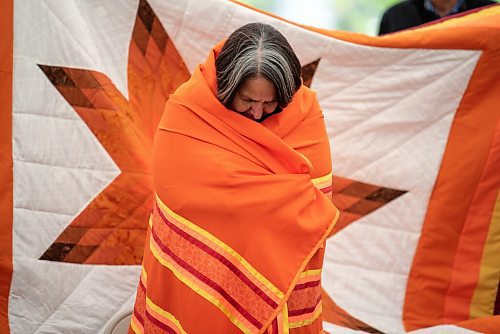 ALEX LUPUL / WINNIPEG FREE PRESS  

Stephanie Scott, Executive Director at NCTR, is photographed wrapped in a shawl and a star blanket during a blessing at the future home of the National Centre for Truth and Reconciliation in Winnipeg on Thursday, August 12, 2021.

Reporter: Cody Sellar