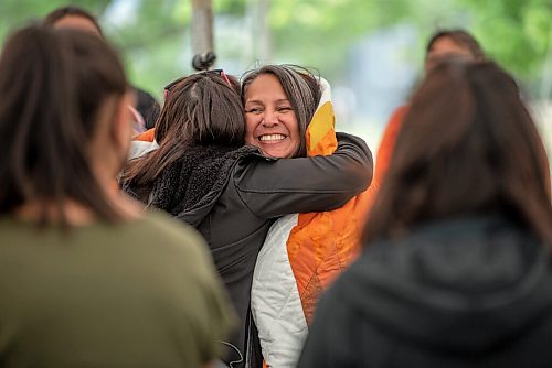 ALEX LUPUL / WINNIPEG FREE PRESS  

Stephanie Scott, Executive Director at NCTR, embraces well wishers after being wrapped in a shawl and a star blanket after a blessing at the future home of the National Centre for Truth and Reconciliation in Winnipeg on Thursday, August 12, 2021.

Reporter: Cody Sellar