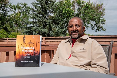 ALEX LUPUL / WINNIPEG FREE PRESS  

Ismael Mukhtar is photographed with his book, Manitoba Muslims, at his home in Winnipeg on Thursday, August 12, 2021. The book is the first comprehensive history of Muslims in Manitoba.

Reporter: Brenda Suderman