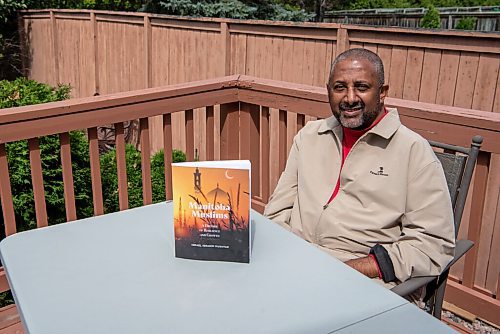 ALEX LUPUL / WINNIPEG FREE PRESS  

Ismael Mukhtar is photographed with his book, Manitoba Muslims, at his home in Winnipeg on Thursday, August 12, 2021. The book is the first comprehensive history of Muslims in Manitoba.

Reporter: Brenda Suderman