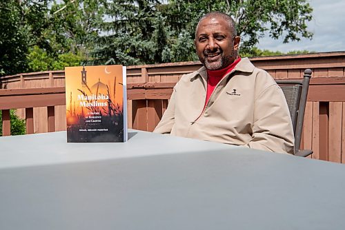 ALEX LUPUL / WINNIPEG FREE PRESS  

Ismael Mukhtar is photographed with his book, Manitoba Muslims, at his home in Winnipeg on Thursday, August 12, 2021. The book is the first comprehensive history of Muslims in Manitoba.

Reporter: Brenda Suderman