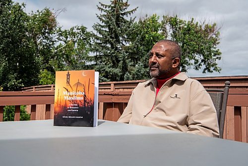 ALEX LUPUL / WINNIPEG FREE PRESS  

Ismael Mukhtar is photographed with his book, Manitoba Muslims, at his home in Winnipeg on Thursday, August 12, 2021. The book is the first comprehensive history of Muslims in Manitoba.

Reporter: Brenda Suderman