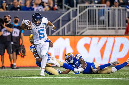 MIKAELA MACKENZIE / WINNIPEG FREE PRESS

Toronto Argonaut John White IV scores the first and only touchdown in a game against the Winnipeg Blue Bombers at IG Field in Winnipeg on Friday, Aug. 13, 2021. For --- story.
Winnipeg Free Press 2021.