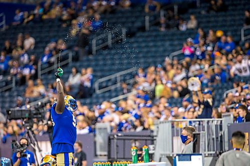 MIKAELA MACKENZIE / WINNIPEG FREE PRESS

Blue Bomber Jermarcus Hardrick amps the crowd up shortly before their win against the Toronto Argonauts at IG Field in Winnipeg on Friday, Aug. 13, 2021. For --- story.
Winnipeg Free Press 2021.