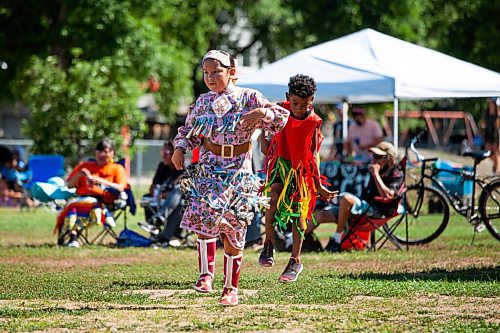 Daniel Crump / Winnipeg Free Press. Young dancers take part in the second annual 1 Just City annual pow wow at the West Broadway Community Centre green space. The event is about honouring, teaching and inviting people to learn about Indigenous dances, ceremonies and cultural practices. August 14, 2021.