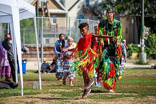 Daniel Crump / Winnipeg Free Press. Young dancers take part in the second annual 1 Just City annual pow wow at the West Broadway Community Centre green space. The event is about honouring, teaching and inviting people to learn about Indigenous dances, ceremonies and cultural practices. August 14, 2021.