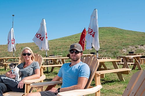 ALEX LUPUL / WINNIPEG FREE PRESS  

From left, Vivianne Julien and Brayden Sosinkalo, co-owners of Springhill Winter Park, are photographed in the ski hill's beer garden on August 13, 2021. 

Reporter: Eva Wasney