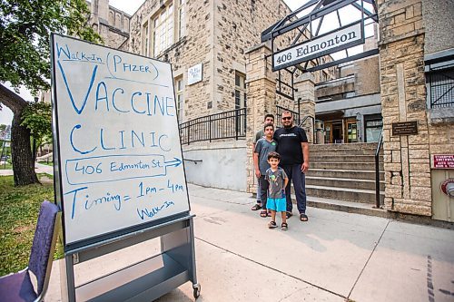 MIKAELA MACKENZIE / WINNIPEG FREE PRESS

Sabawoon Jamdar and his kids, Mohammed (15), About Baker (13), and Yaseem (four), pose for a photo after getting their first dose at the Manitoba Islamic Association vaccine clinic at 406 Edmonton in Winnipeg on Monday, Aug. 16, 2021. For Gabby story.
Winnipeg Free Press 2021.