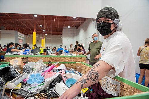 ALEX LUPUL / WINNIPEG FREE PRESS  

Dakota Hocking, 25, is photographed at Krazy Binz, a newly opened store that sells overstock and returned items from online retailers, on August 17, 2021.

Reporter: Cody Sellar