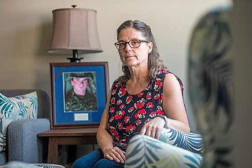 MIKAELA MACKENZIE / WINNIPEG FREE PRESS

Anita Cenerini, mother of Pte. Thomas Welch, poses for a portrait in her home in Winnipeg on Wednesday, Aug. 18, 2021. She has mixed feelings over the fall of Afghanistan to the Taliban. For Erik story.
Winnipeg Free Press 2021.