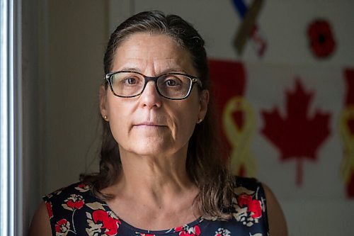 MIKAELA MACKENZIE / WINNIPEG FREE PRESS

Anita Cenerini, mother of Pte. Thomas Welch, poses for a portrait in her home in Winnipeg on Wednesday, Aug. 18, 2021. She has mixed feelings over the fall of Afghanistan to the Taliban. For Erik story.
Winnipeg Free Press 2021.