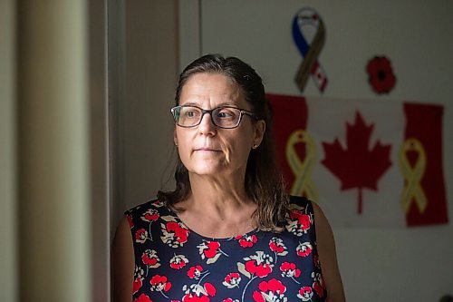 MIKAELA MACKENZIE / WINNIPEG FREE PRESS

Anita Cenerini, mother of Pte. Thomas Welch, poses for a portrait in her home in Winnipeg on Wednesday, Aug. 18, 2021. She has mixed feelings over the fall of Afghanistan to the Taliban. For Erik story.
Winnipeg Free Press 2021.