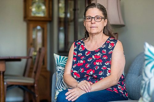 MIKAELA MACKENZIE / WINNIPEG FREE PRESS

Anita Cenerini, mother of Pte. Thomas Welch, poses for a portrait in her home in Winnipeg on Wednesday, Aug. 18, 2021. She has mixed feelings over the fall of Afghanistan to the Taliban. For Erik story.
Winnipeg Free Press 2021.