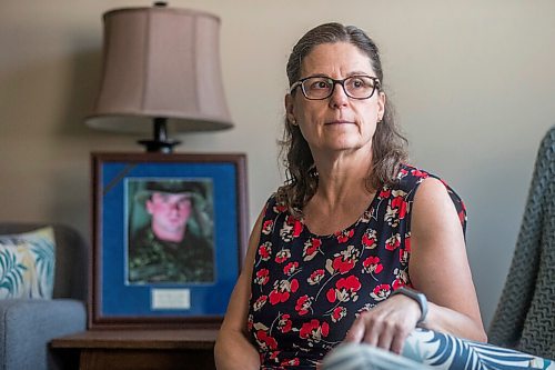 MIKAELA MACKENZIE / WINNIPEG FREE PRESS

Anita Cenerini, mother of Pte. Thomas Welch, poses for a portrait in her home in Winnipeg on Wednesday, Aug. 18, 2021. She has mixed feelings over the fall of Afghanistan to the Taliban. For Erik story.
Winnipeg Free Press 2021.