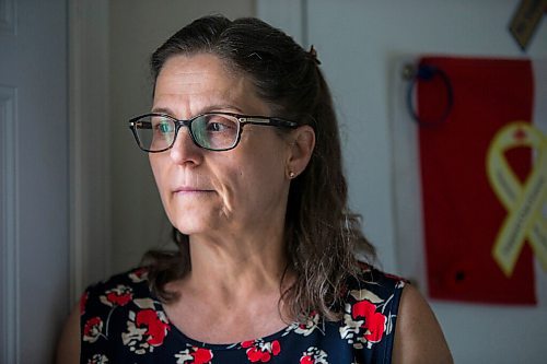 MIKAELA MACKENZIE / WINNIPEG FREE PRESS

Anita Cenerini, mother of Pte. Thomas Welch, poses for a portrait in her home in Winnipeg on Wednesday, Aug. 18, 2021. She has mixed feelings over the fall of Afghanistan to the Taliban. For Erik story.
Winnipeg Free Press 2021.