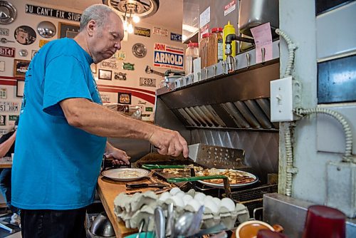ALEX LUPUL / WINNIPEG FREE PRESS  

Rick Wareham, owner of Big Rick's Hot Rod Diner in Winnipeg, is photographed preparing food on August 19, 2021.

Reporter: Dave Sanderson
