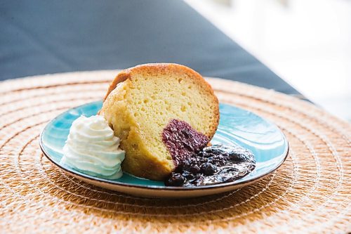 MIKAELA MACKENZIE / WINNIPEG FREE PRESS

Rum cake with berry compote at Gladys Caribbean Kitchen in Winnipeg on Thursday, Aug. 19, 2021. For --- story.
Winnipeg Free Press 2021.