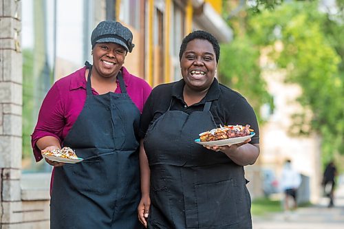 MIKAELA MACKENZIE / WINNIPEG FREE PRESS
Co-owners Deidré Coleman (left) and Patrice Gilman show off two of their signature dishes, ackee and salted cod tacos and jerk chicken, at Gladys Caribbean Kitchen in Winnipeg on Thursday, Aug. 19, 2021. For --- story.
Winnipeg Free Press 2021.