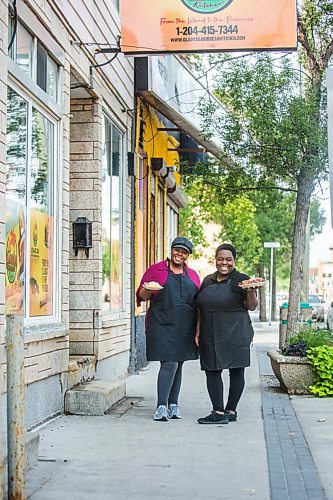 MIKAELA MACKENZIE / WINNIPEG FREE PRESS
Co-owners Deidré Coleman (left) and Patrice Gilman show off two of their signature dishes, ackee and salted cod tacos and jerk chicken, at Gladys Caribbean Kitchen in Winnipeg on Thursday, Aug. 19, 2021. For --- story.
Winnipeg Free Press 2021.