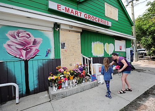 RUTH BONNEVILLE / WINNIPEG FREE PRESS

local - MEMORIAL FOR ARSON VICTIM

MEMORIAL FOR ARSON VICTIM: 

Hannah Kennedy - 8yrs, and her mom, Carol Kennedy, bring flowers and a card to the memorial site on the steps of the EZ Mart on Thursday.  

Info: A memorial of flowers, poems and writings has been set up on the front door to EZ Mart in honour of  Jung Ja Shin, the convenience store owner killed in an arson in the Osborne Village area recently.  A memorial walk is set up for Thursday evening at 8pm -  tonight. 
Police are searching for a suspect, seen in security video, in a total of four fires. 

ERIK 

Aug 19th, 2021
