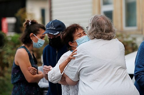 JOHN WOODS / WINNIPEG FREE PRESS
Sixty-five people gathered for a vigil and walk for Jung Ja Shin, the convenience store owner killed in an Osborne Village arson in Winnipeg Thursday, August 19, 2021.

Reporter: Pindera