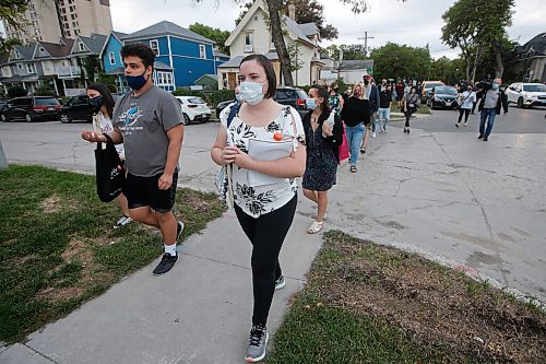 JOHN WOODS / WINNIPEG FREE PRESS
Sixty-five people gathered for a vigil and walk for Jung Ja Shin, the convenience store owner killed in an Osborne Village arson in Winnipeg Thursday, August 19, 2021.

Reporter: Pindera