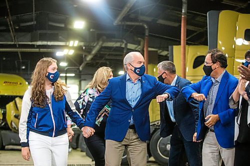 MIKAELA MACKENZIE / WINNIPEG FREE PRESS

Conservative leader Erin OToole elbow-bumps Marty Morantz while walking in with his daughter, Mollie O'Toole, before making an announcement at Bison Transport in Winnipeg on Friday, Aug. 20, 2021. For Dylan/Dan story.
Winnipeg Free Press 2021.