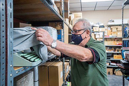 MIKAELA MACKENZIE / WINNIPEG FREE PRESS

Izu Gephter uncovers all sorts of restored typewriters at I. G. Office Equipment in Winnipeg on Friday, Aug. 20, 2021. For Dave Sanderson story.
Winnipeg Free Press 2021.