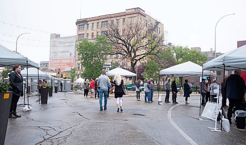 MIKE SUDOMA / Winnipeg Free Press
A couple hold hands as they walk around the Burt Block Party event grounds Friday evening. 
August 20, 2021