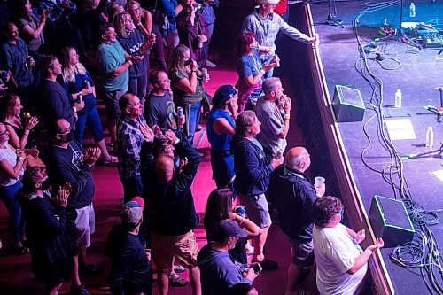 MIKE SUDOMA / Winnipeg Free Press
Audience members on the floor cheer as the Northern Pikes finish a song at the Burton Cummings Theatre for the Burt Block Party event Friday evening
August 20, 2021
