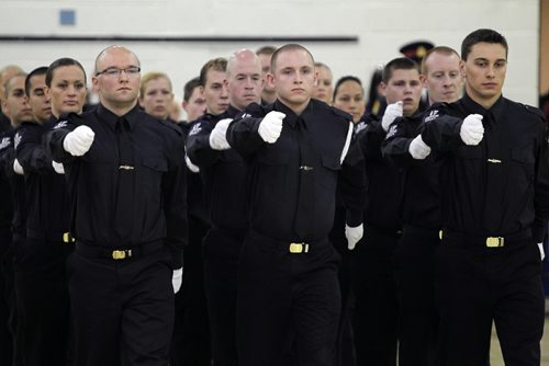 Brandon Sun Recruits line in formation during the completion ceremonies for the 2009-2010 Police Studies Class, Friday morning at Assiniboine Community College. (Colin Corneau/Brandon Sun)