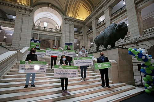 WINNIPEG FREE PRESS/SHANNON VANRAES
Advanced Education Minister Wayne Ewasko poses for a photo with the Vax to Win scholarship recipients at the Manitoba Legislative Building August 23, 2021.