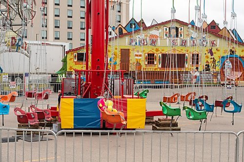 MIKE SUDOMA / Winnipeg Free Press
A lone stuffed monkey sits on the swings ride at a Wonder Shows carnival located in the parking lot of the Victoria Inn at the airport Monday afternoon 
August 23, 2021