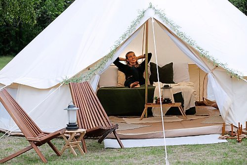 JOHN WOODS / WINNIPEG FREE PRESS
Sarah Scott, owner of Canadiana Camper & Co., sets up one of her glamping tents at Assiniboine Park in Winnipeg Monday, August 23, 2021. Scott has launched the new glamping camp experience where her and her team will come and set up prospector-style canvas tents in peoples yards. Her clients can enjoy a relaxing camp experience in their backyards.
Reporter: Durrani